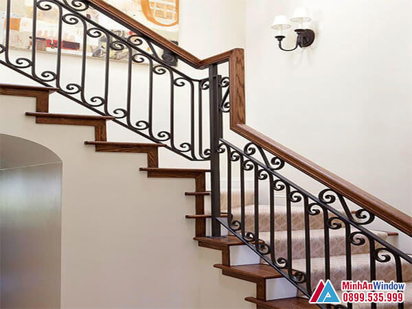 Cầu thang sắt mỹ thuật cao cấp tay vịn gỗ - minh an window đã thi công Cầu thang sắt mỹ thuật cao cấp tay vịn gỗ - Minh An Window đã thi công